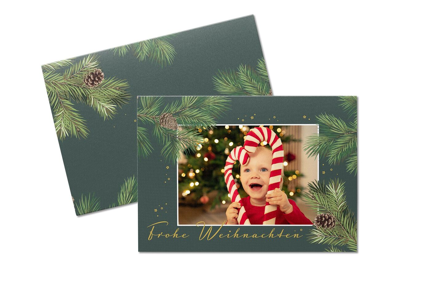Weihnachtliche Grußkarte mit Tannenzweigen und süßen Süßigkeiten-Sticks