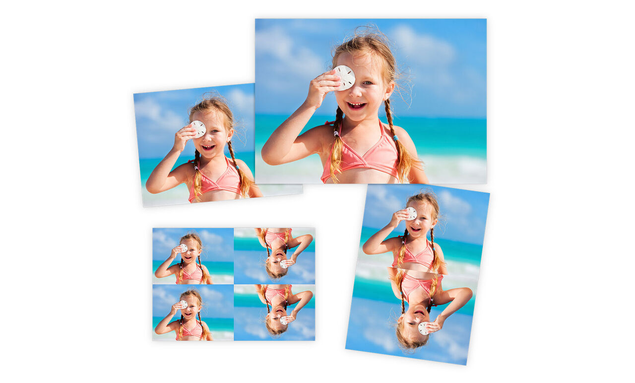 Ein fröhliches Kind mit Sonnenbrille am Strand unter bläulichem Himmel