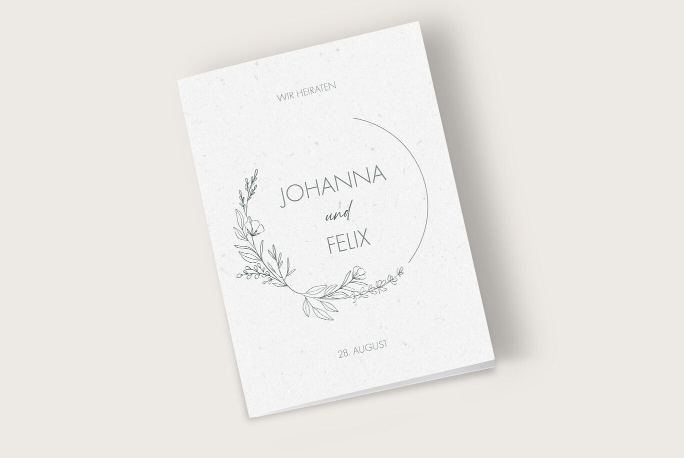 Elegante Einladungskarte zur Hochzeit mit floralem Design und den Namen Johanna und Felix