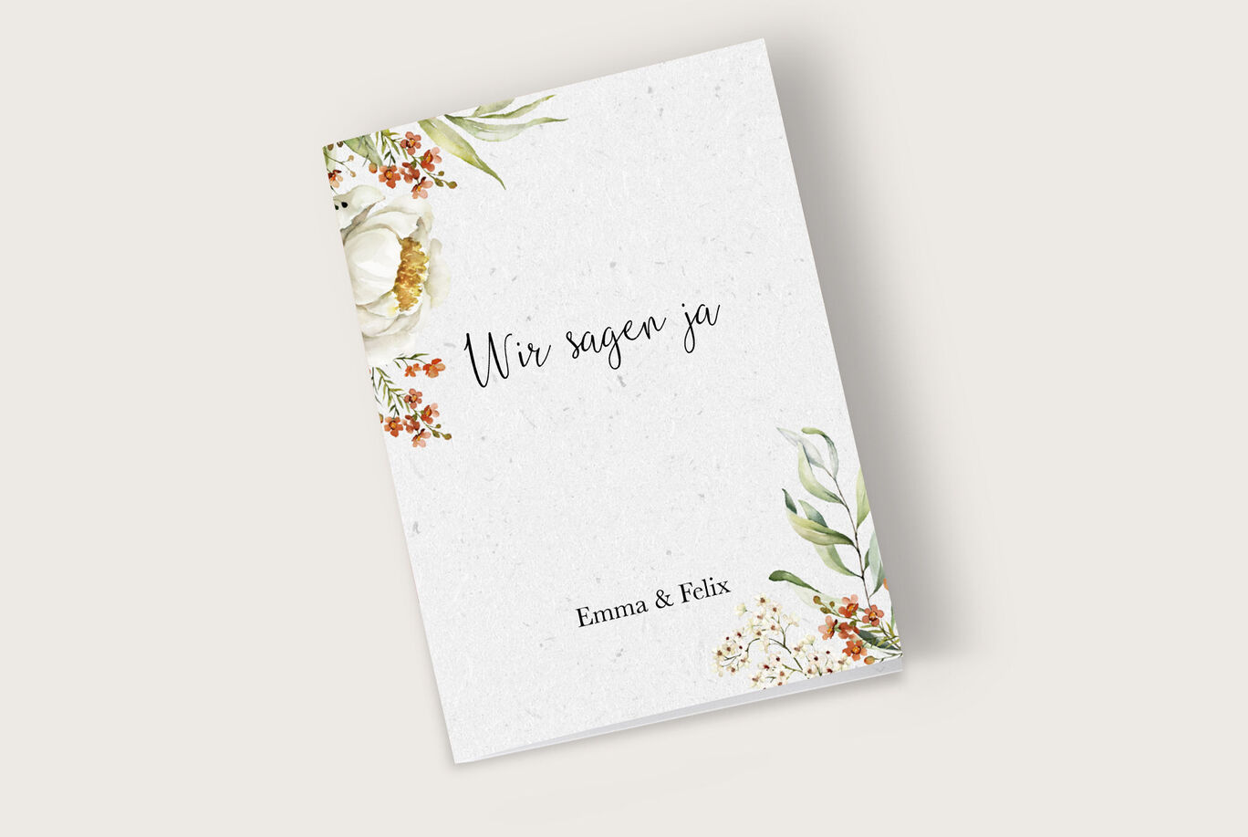 Eine elegante Einladung zur Hochzeit mit floralen Akzenten und dem Text: "Wir sagen ja".