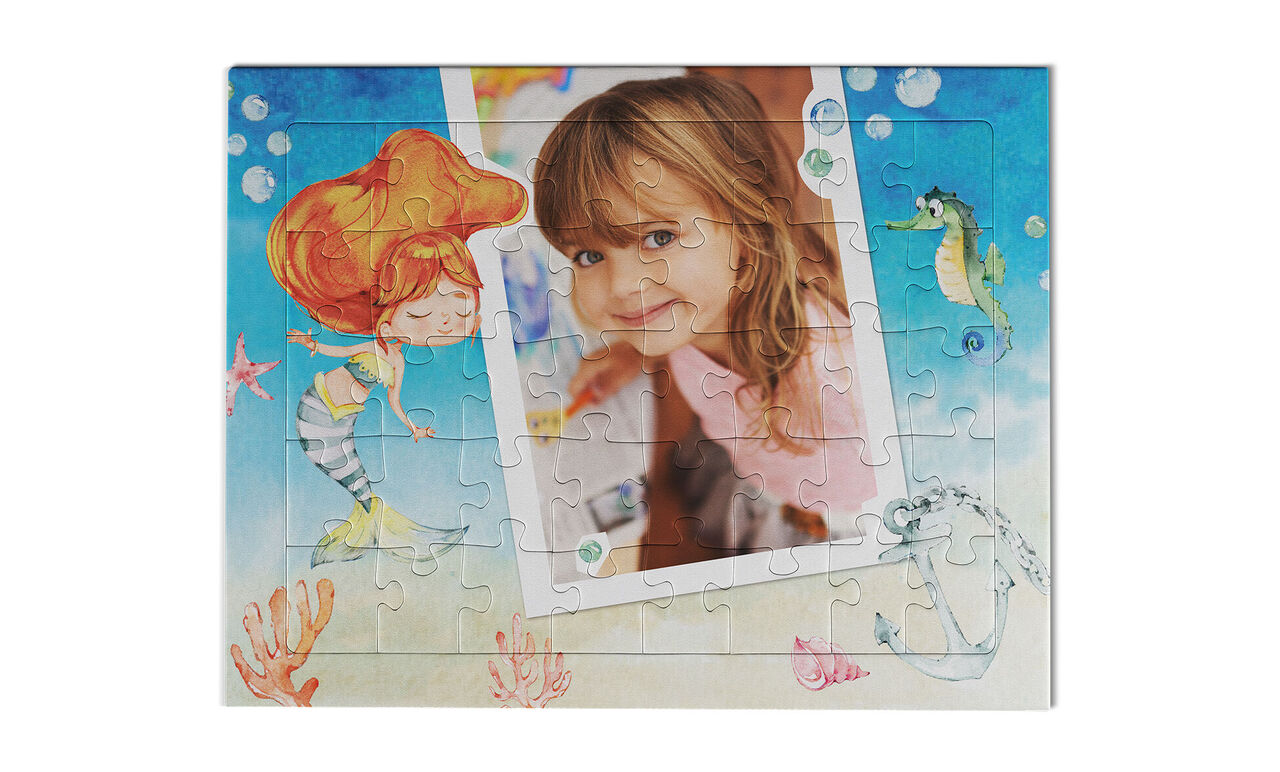 Ein liebevolles Puzzle mit einer bunten Unterwasserwelt und einer leeren Fotofläche.