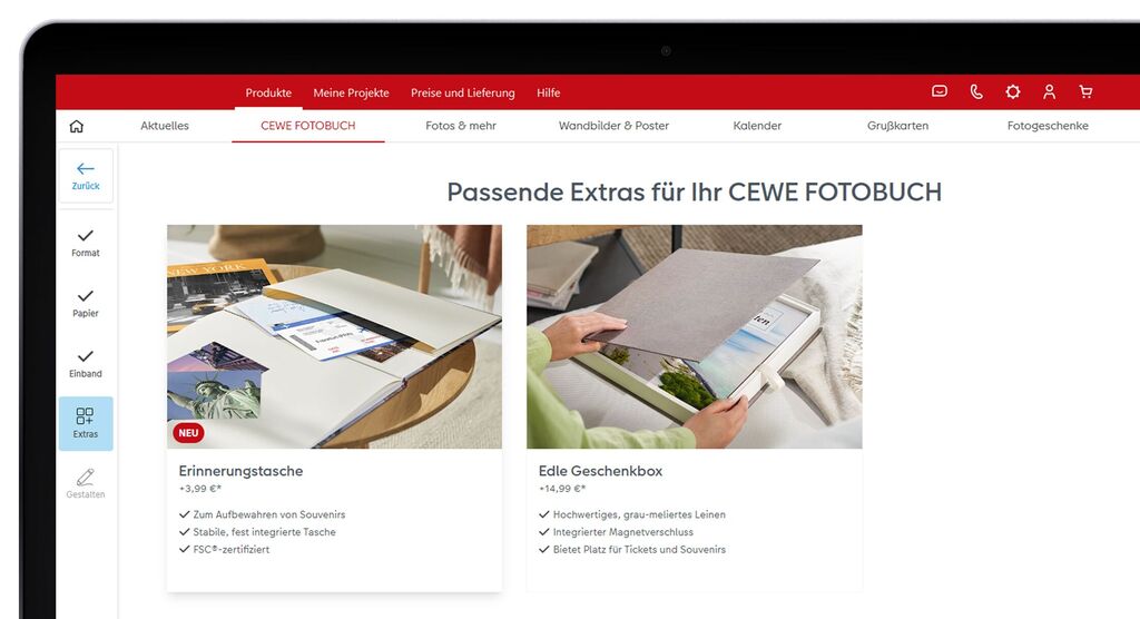 Zwei Produkte für das CEWE FOTOBUCH: eine Erinnerungstasche und eine edle Geschenkbox auf einem Tisch