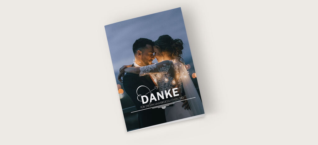 Ein wunderschönes Fotobuch mit dem Titel "DANKE" und einer romantischen Umarmung auf dem Cover.