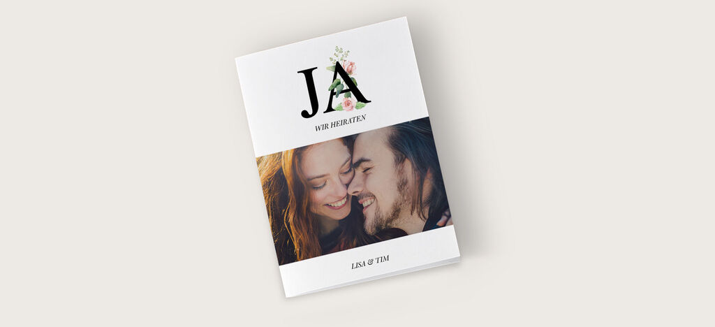 Ein elegantes Fotobuch mit dem Titel "JA" und floralem Design.