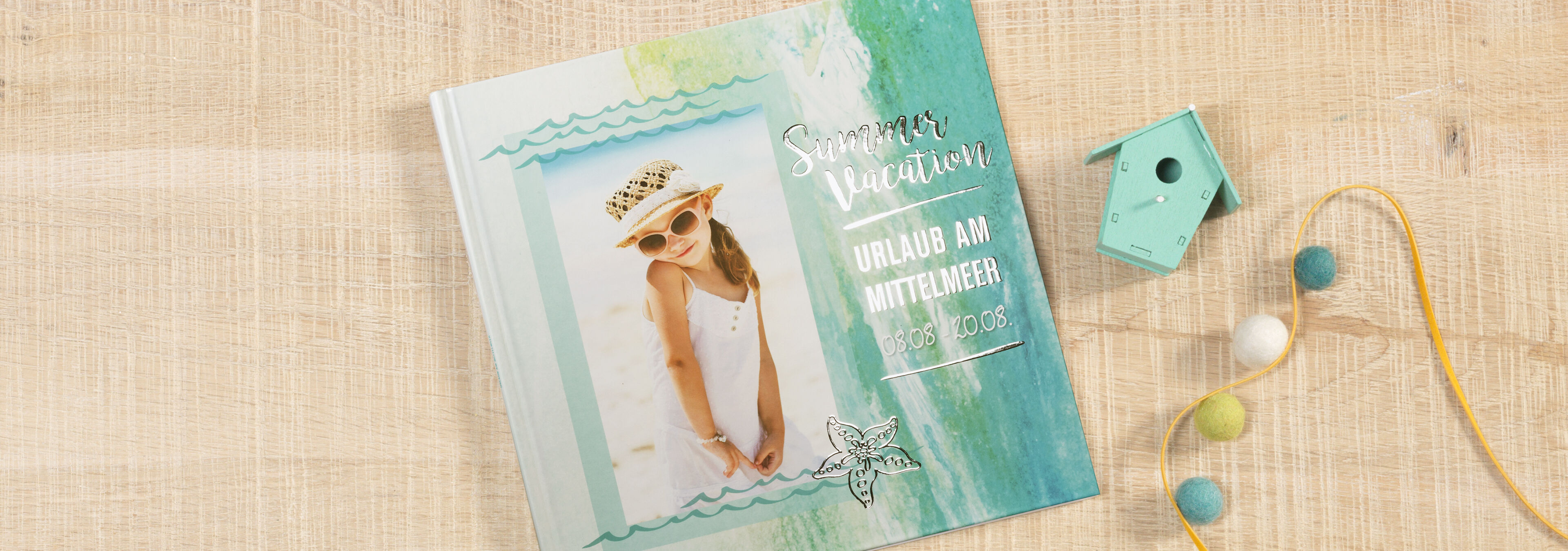 Gestaltung eines sommerlichen Urlaubsfotos in einem CEWE FOTOBUCH.