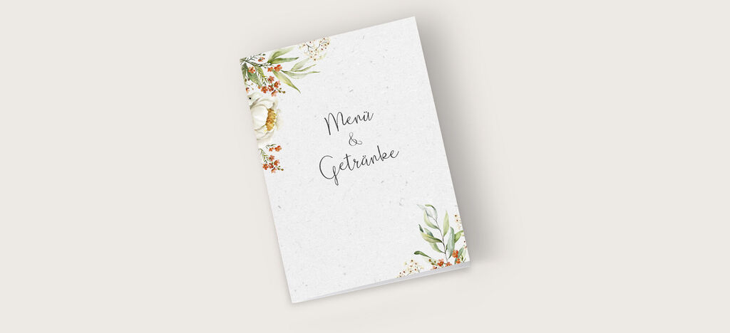 Wunderschön gestaltetes Menü mit floralen Akzenten und handschriftlicher Schriftzüge