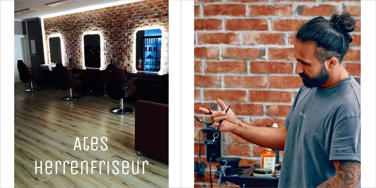 Modern eingerichteter Herrenfriseur mit Spiegeln und Stühlen