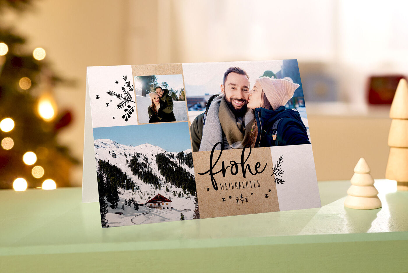 CEWE Klappkarte mit Fotocollage: Paar küsst sich, Berglandschaft und Schrift Frohe Weihnachten