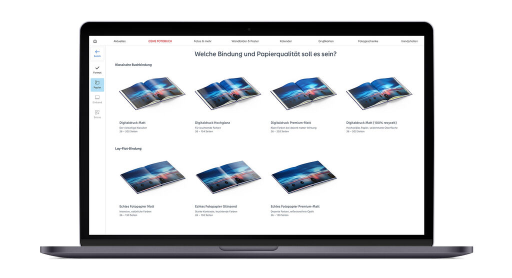 Ansicht der CEWE FOTOBUCH-Optionen für Papierarten und Bindungen auf einem Laptop-Bildschirm